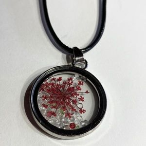 Encased floral pendant